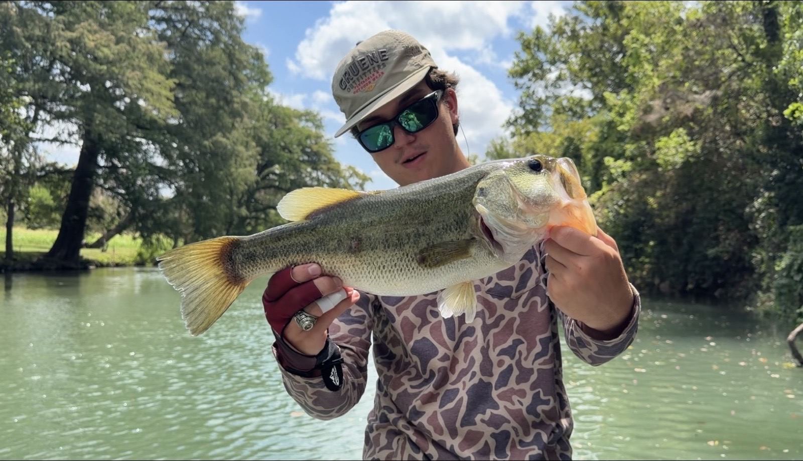 Client holding a largemouth bass